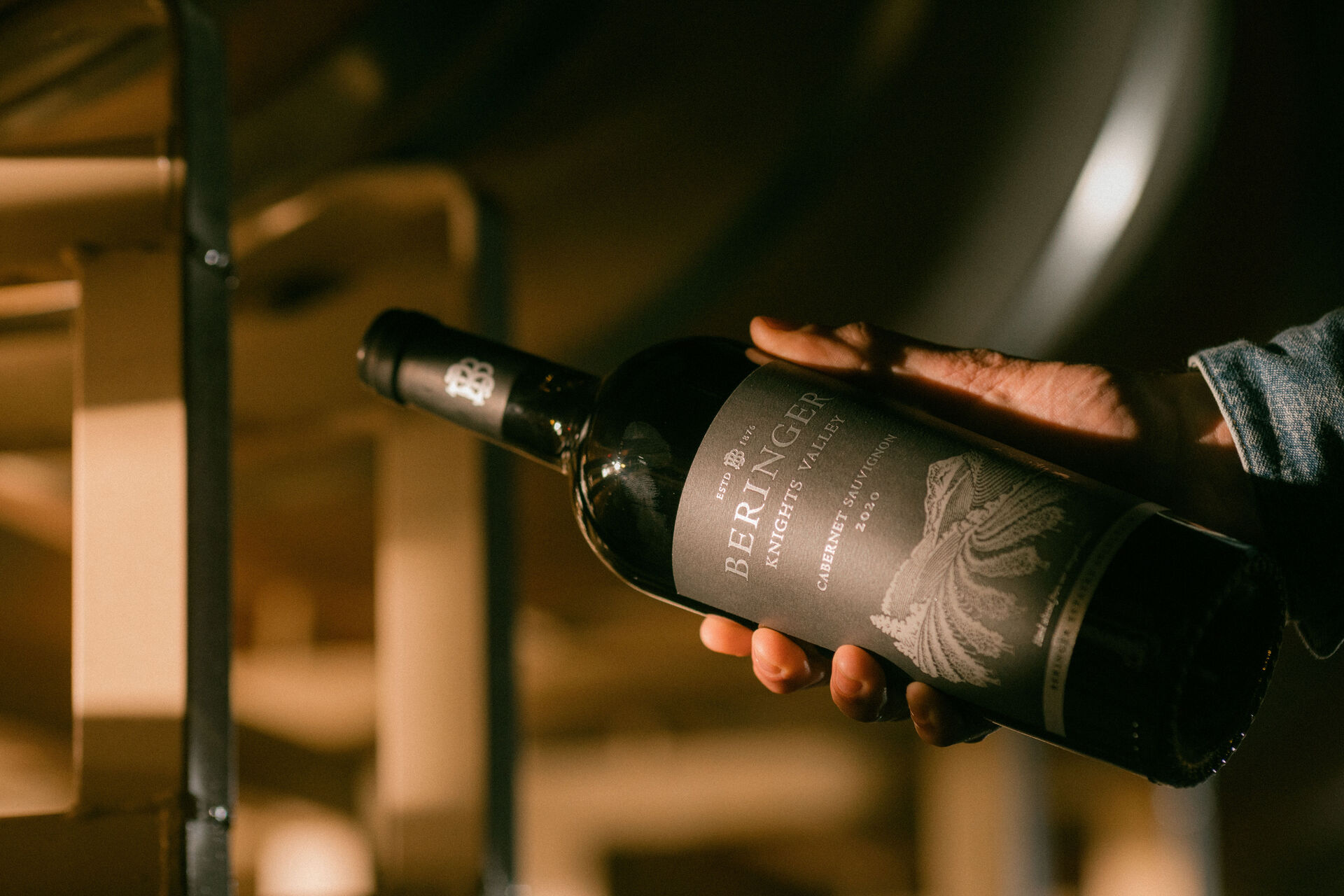 Hand holding bottle of 2020 Beringer Knights Valley cabernet sauvignon