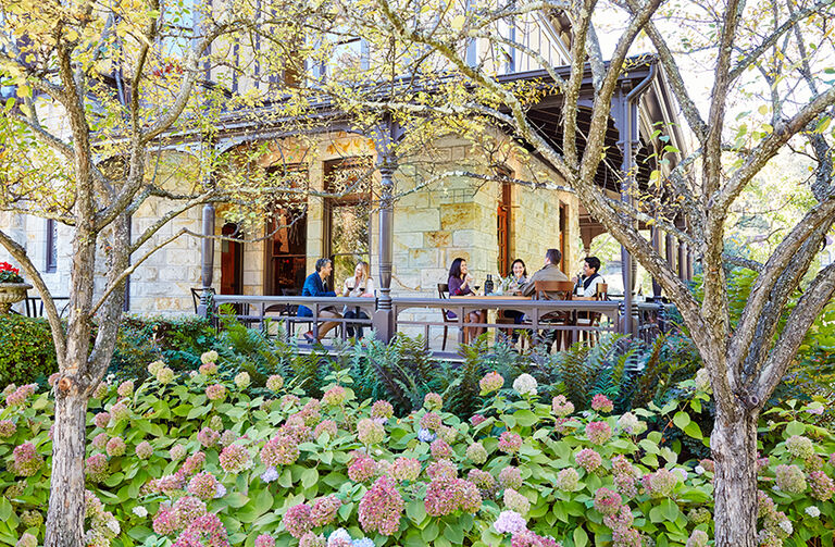 Guests Tasting Wine on the Porch of the Rhine House